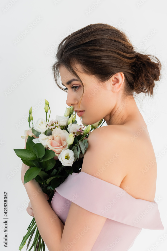 charming fiancee posing with wedding bouquet isolated on white charming fiancee posing with wedding bouquet isolated on white