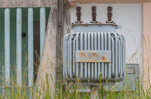 Electricity transformer in abandoned house photo