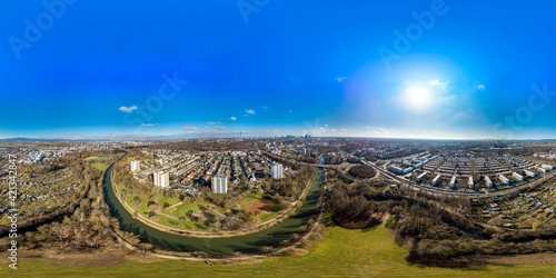 Beautiful aerial Panorama 360 view on european finance center city Frankfurt am Main downtown skyline in spring. Blue sky, clouds, green trees. Hesse, Germany