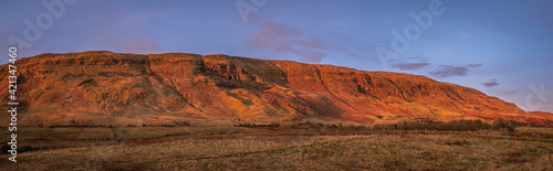 Red glow of Sunset on The Campsie Fells, near Lennoxtown, Scotland
