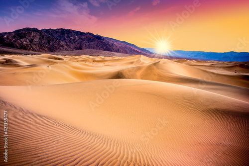 Death Valley  California sand dunes with colorful sunset