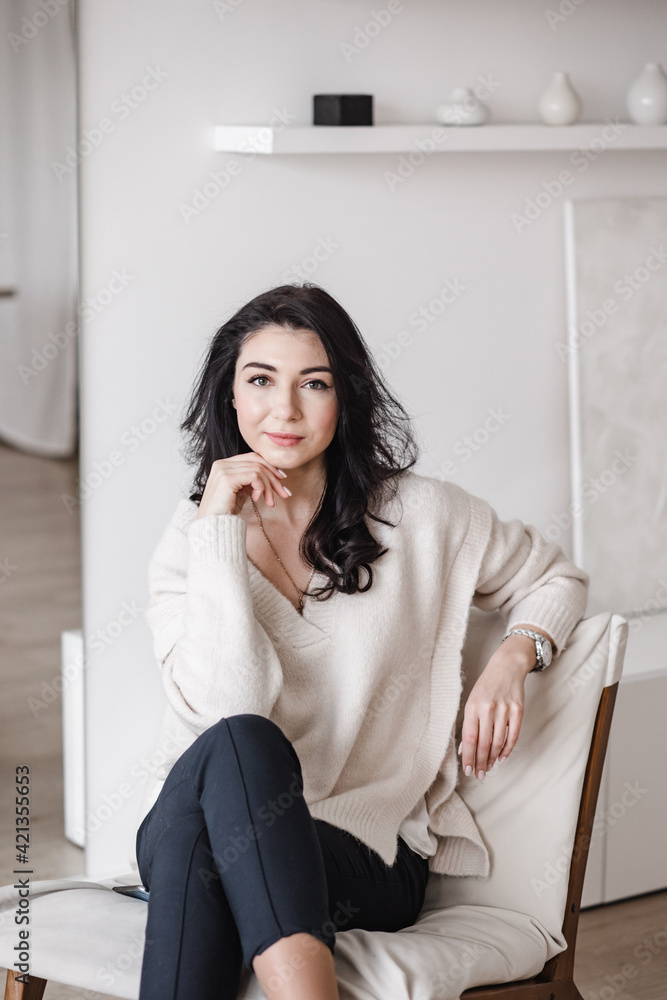 Female entrepreneur sitting in contemporary workplace Female entrepreneur sitting in contemporary workplace