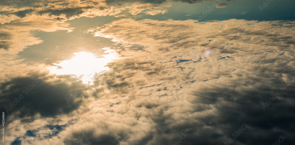 above the clouds aerial view at sunset