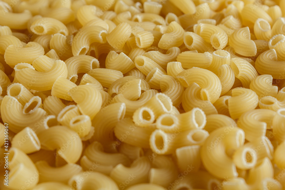 raw italian pasta background. top side view. textured raw italian pasta background. top side view. textured