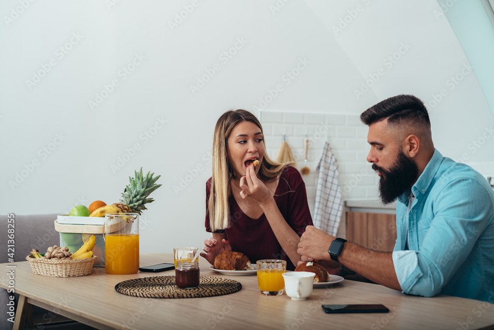 Couple having breakfast at home Couple having breakfast at home