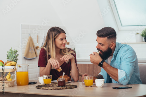 Couple in love having breakfast at home