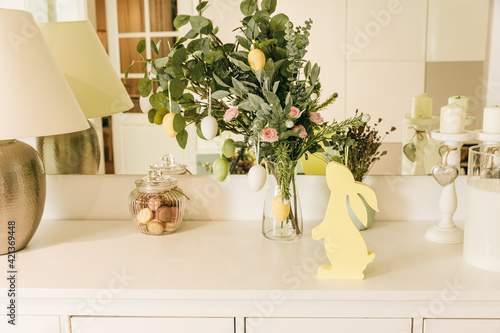 Wall Mural Green branches decorated with eggs