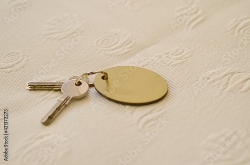 Keys of room of a rural hotel with a plate to put in room number.hotel concept.