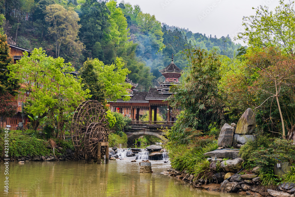 Wind and Rain Bridge and Waterwheel in Dong Village, Zhaoxing, Guizhou, China Wind and Rain Bridge and Waterwheel in Dong Village, Zhaoxing, Guizhou, China