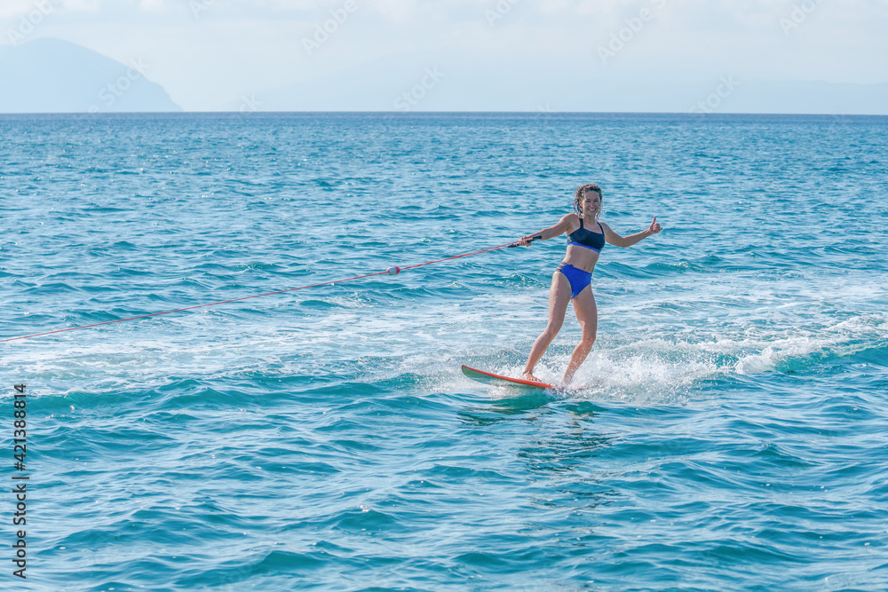 Wakeboarding with a surfboard in Greece. Wakeboarding with a surfboard in Greece.