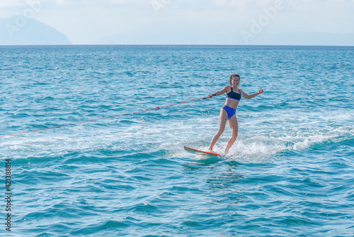 Wakeboarding with a surfboard in Greece. © Hardi