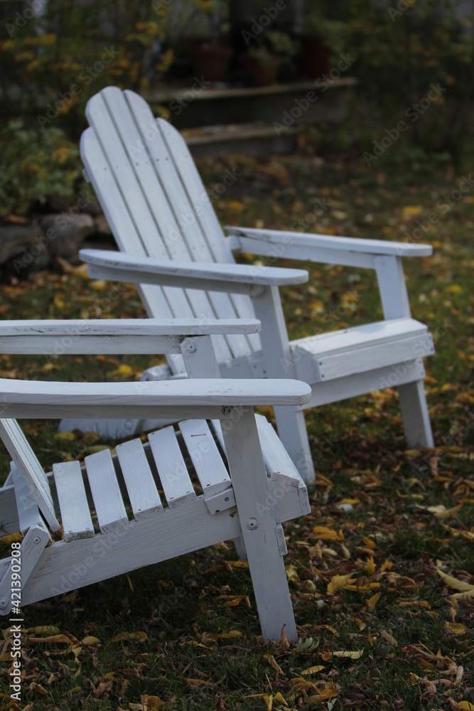 White Adirondack Chairs in the Yard