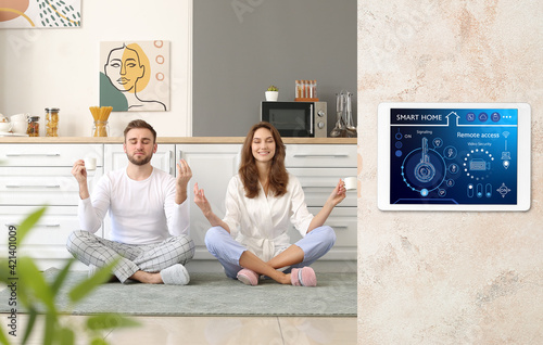 Young couple meditating in ...