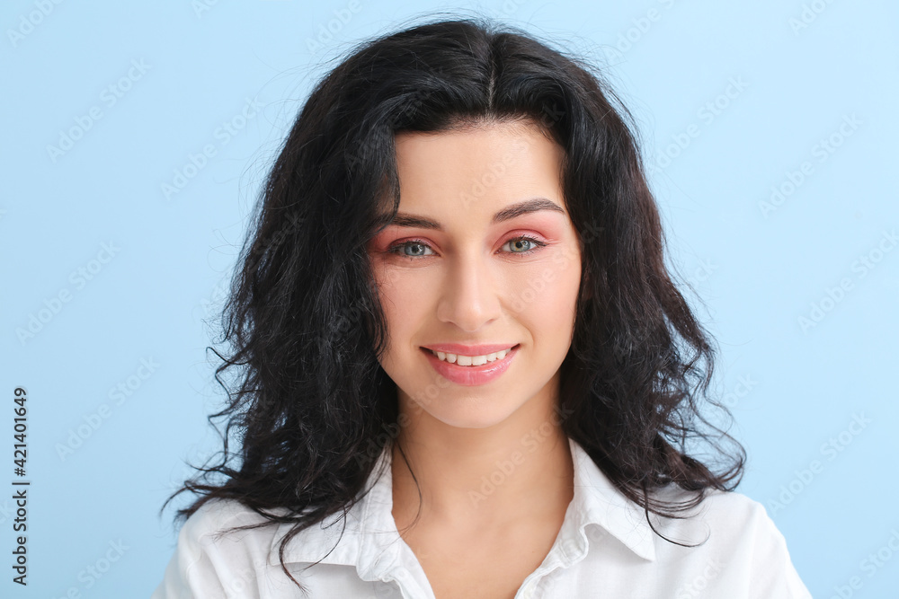 Portrait of young woman with beautiful curly hair on color background, closeup Portrait of young woman with beautiful curly hair on color background, closeup