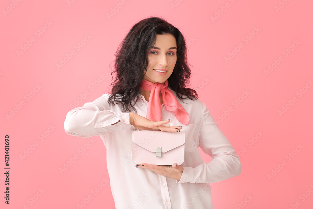 Portrait of young woman with beautiful curly hair and stylish bag on color background Portrait of young woman with beautiful curly hair and stylish bag on color background