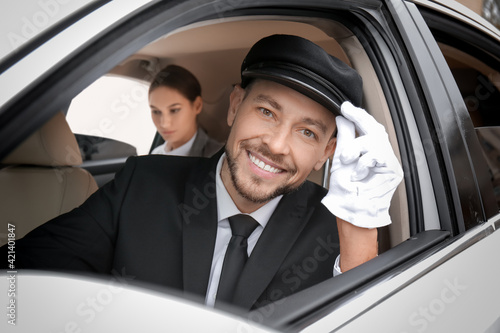 Handsome chauffeur driving ...
