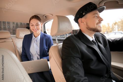 Chauffeur and passenger sit...