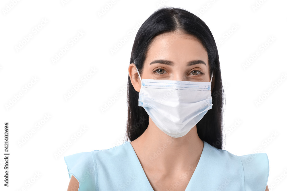 Young woman wearing medical mask on white background Young woman wearing medical mask on white background