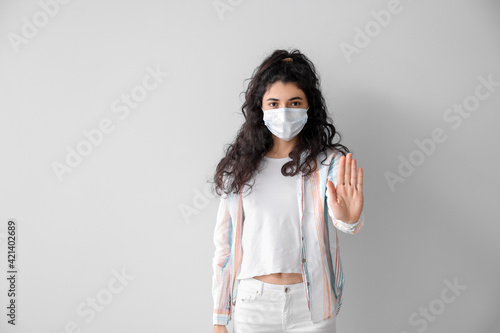 Young woman in medical mask...