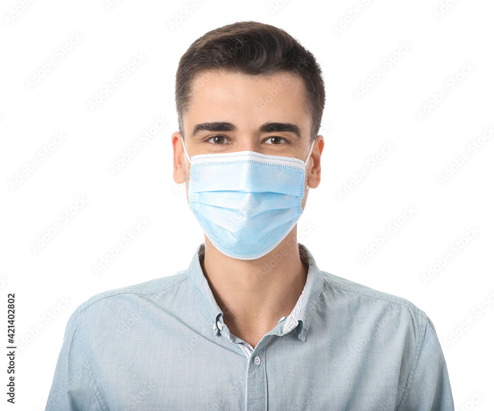 Young man wearing medical mask on white background Young man wearing medical mask on white background