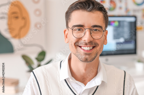 Portrait of male designer in office