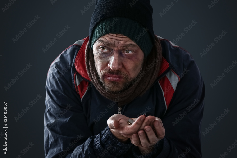 Portrait of poor homeless man on dark background Portrait of poor homeless man on dark background