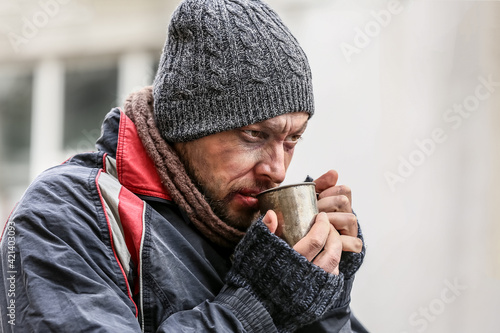 Poor homeless man with cup ...