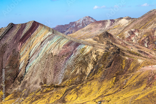 colorful landscape of the Palccoyo Rainbow Mountain in Peru.