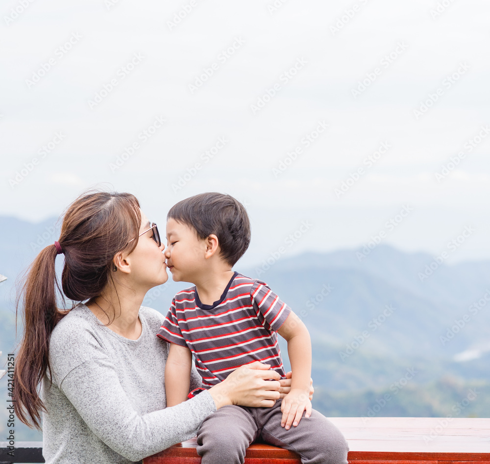 Portrait asian mother and son toddler boy child kissing playing having fun together.Happy son and mother laughing and kissing outdoor.Love family lifestyle single mom.Mother’s day holiday.childhood. Portrait asian mother and son toddler boy child kissing playing having fun together.Happy son and mother laughing and kissing outdoor.Love family lifestyle single mom.Mother’s day holiday.childhood.