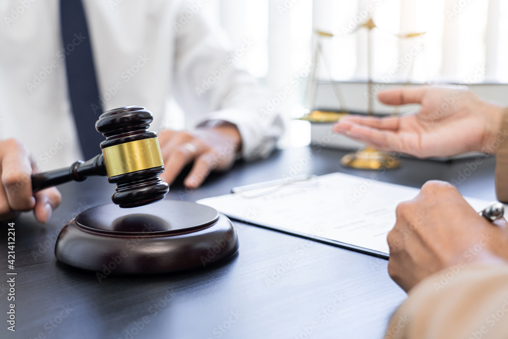 lawyer or judge meeting with client consulting help discussing contract paper agreement. lawyer or judge meeting with client consulting help discussing contract paper agreement.