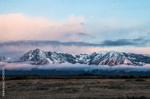 dramatic snowcapped mountain landscape in the Grand Tetons National Park in Wyoming.