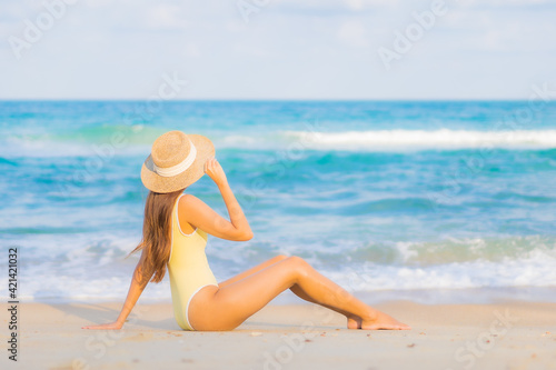 Portrait beautiful young asian woman relax smile leisure around beach sea ocean