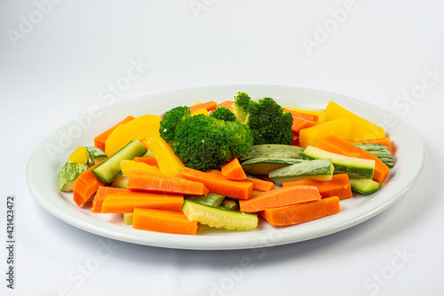 zucchini, carrot, broccoli, parsnip, steamed salad. White background