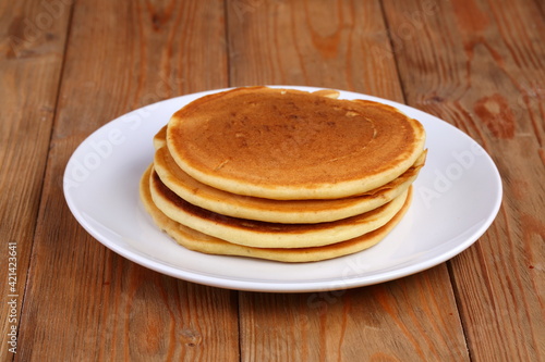 Pancakes on wooden background
