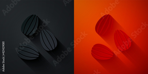 Paper cut Seeds of a specific plant icon isolated on black and red background. Paper art style. Vector