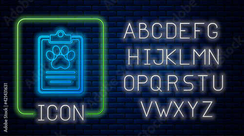 Glowing neon Clipboard with medical clinical record pet icon isolated on brick wall background. Health insurance form. Medical check marks report. Neon light alphabet. Vector