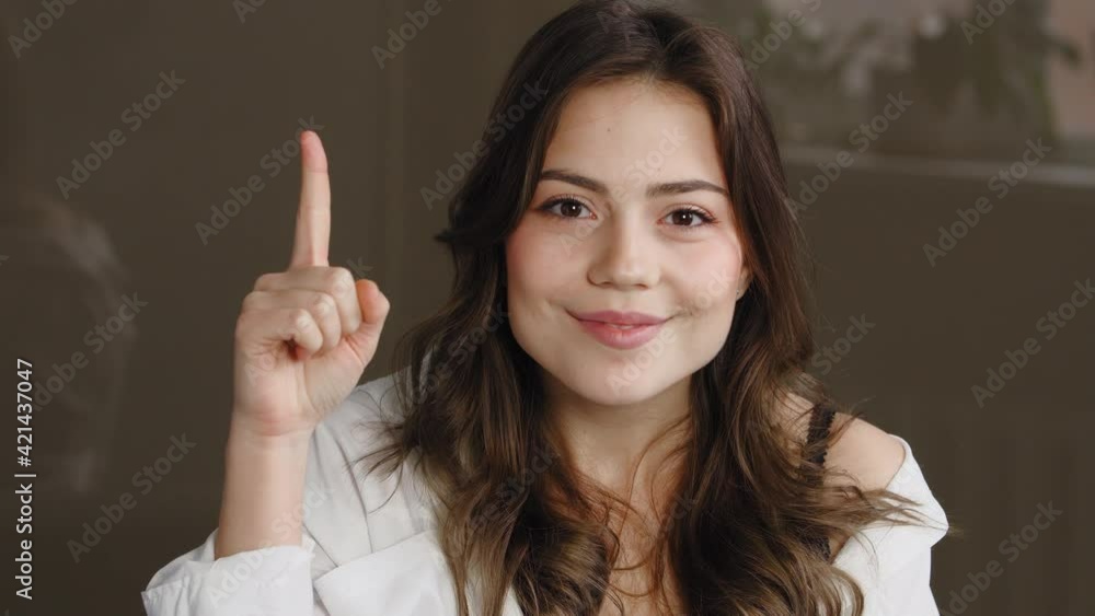 Close-up of thoughtful female face. Pensive young caucasian woman young girl thinking planning recalling memory, comes up with ideas raised finger up opens mouth with delight, isolated indoor at home Close-up of thoughtful female face. Pensive young caucasian woman young girl thinking planning recalling memory, comes up with ideas raised finger up opens mouth with delight, isolated indoor at home