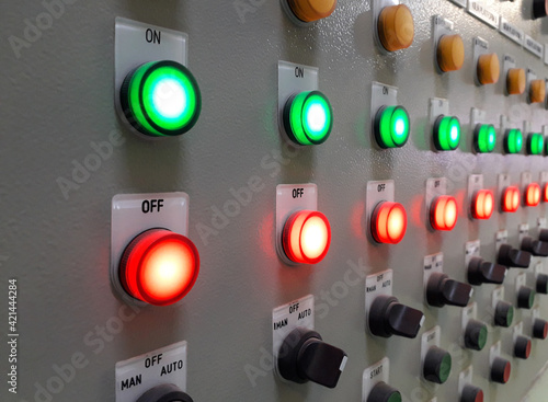 Electrical panel display and push botton switch on control cablinet in industrial. photo