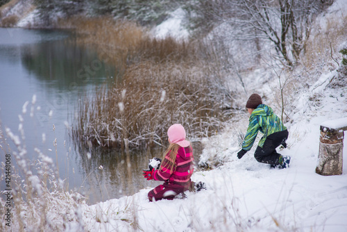 children walking in winter nature, selective focus