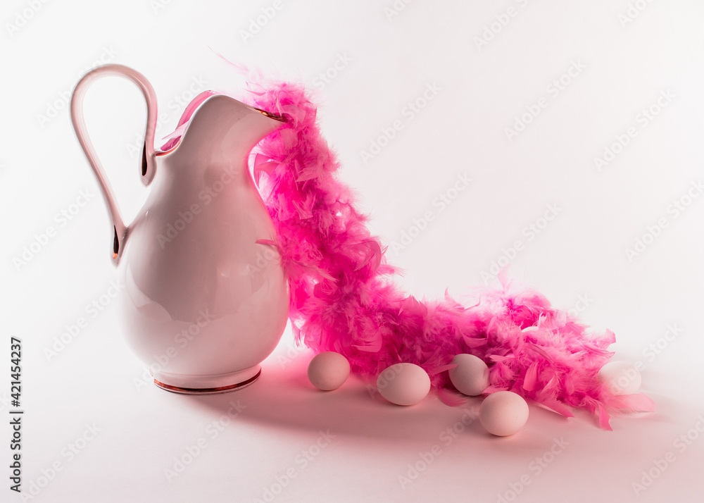 Elegantly decorated Easter in pink and white. Vintage jug and five eggs on a white background.