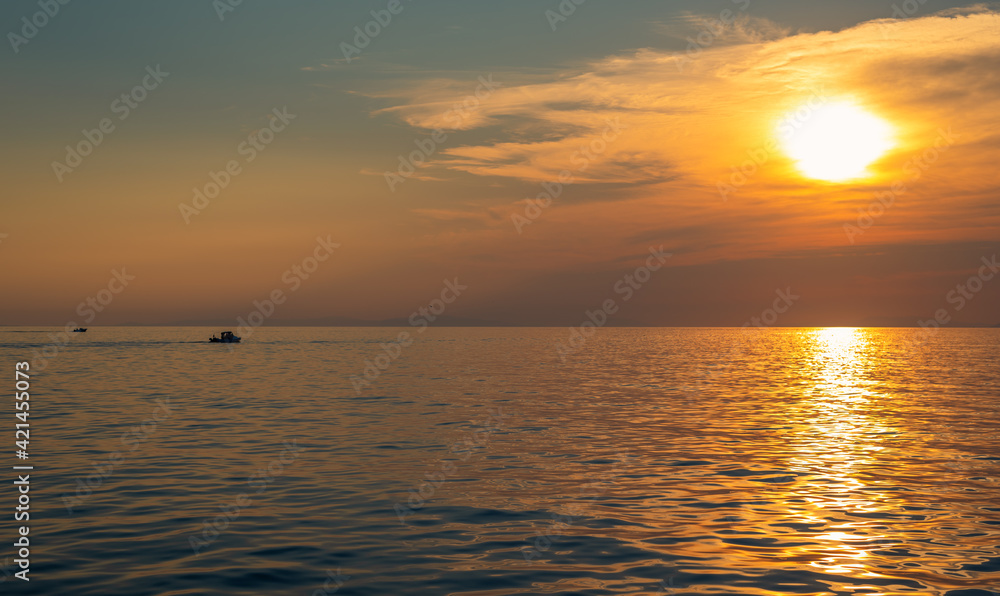Incredible sunset at sea with calm water. Inspirational background