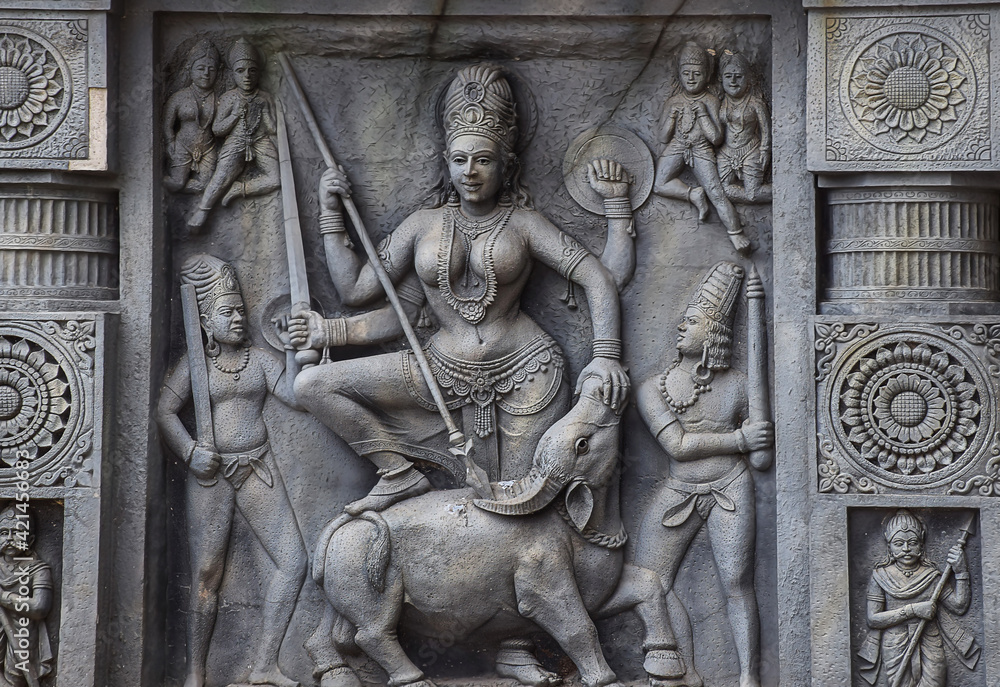 Stock photo of intricate sculpture of Indian goddess Parvati, carved out of stone in ancient hindu temple at Kolhapur city Maharashtra India. focus on object.
