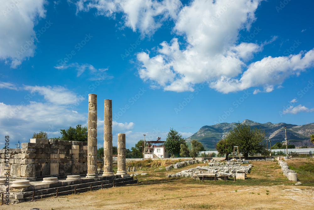 Ruins columns of Temple of Leto in Letoon Ancient City in village Kumluova, Turkey. Sunny day, Greek architecture temple ruins