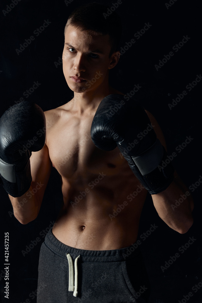 sports guy on a black background in boxing gloves inflated torso cropped view Model 