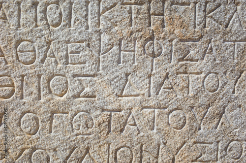 Ancient greek writing on stone in ancient city of Patara, Turkey. Close up detail
