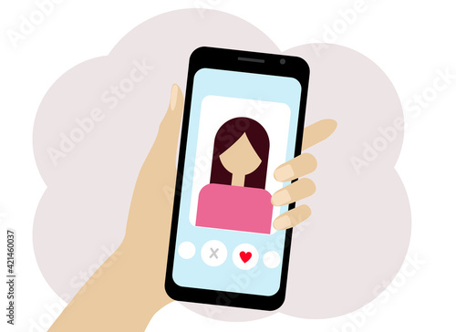 Hand with the phone. The phone has an online dating program.