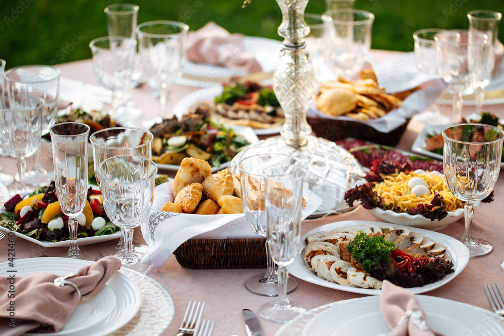 Served outdoor banquet table with assorted oriental appetizers