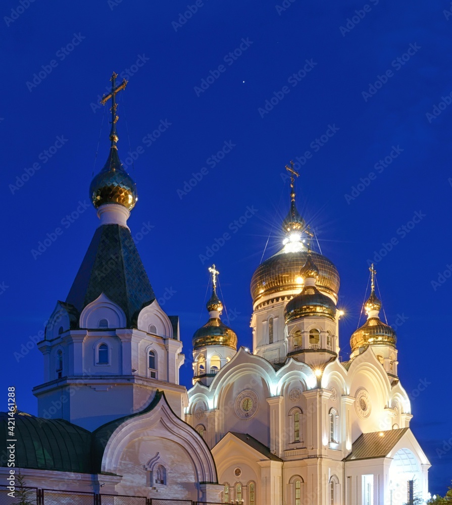 Night Khabarovsk. Transfiguration Cathedral and theological seminary building. Far East, Russia.