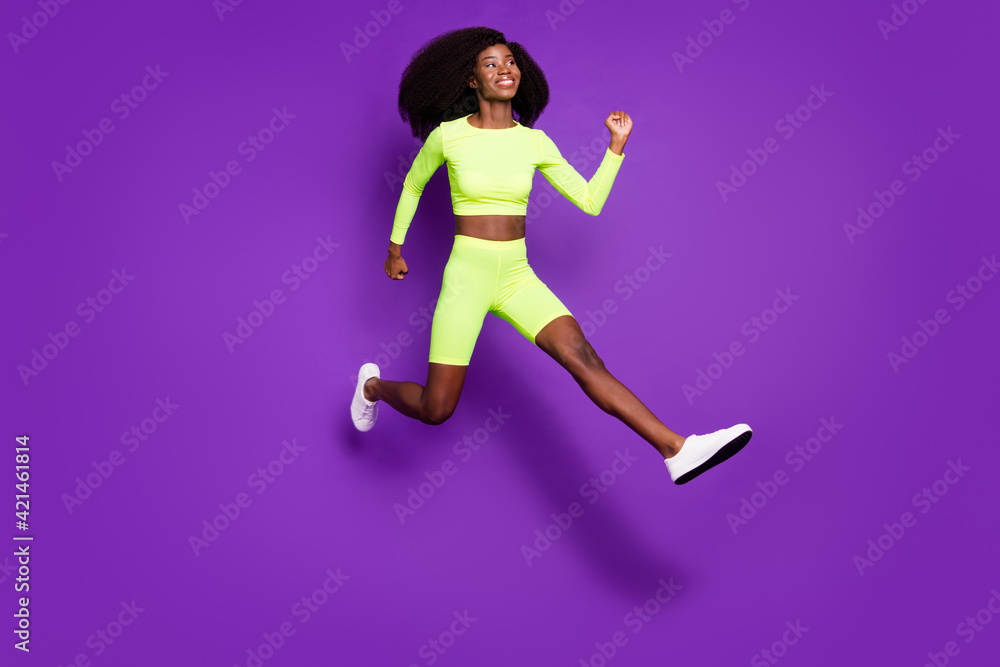 Profile photo of active young lady jump run empty space wear green shirt shorts footwear isolated purple background Profile photo of active young lady jump run empty space wear green shirt shorts footwear isolated purple background