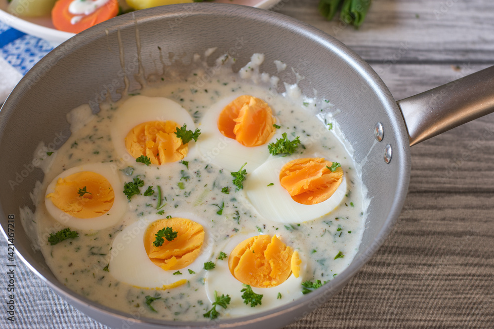 A pot with boiled eggs and sauce A pot with boiled eggs and sauce
